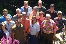 John with staff in his garden