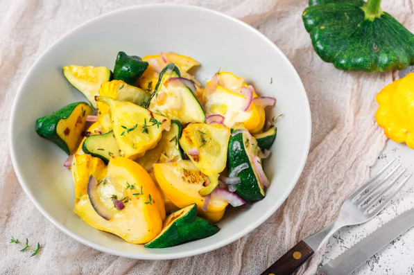 Photo of roasted patty pan with shallots in a bowl