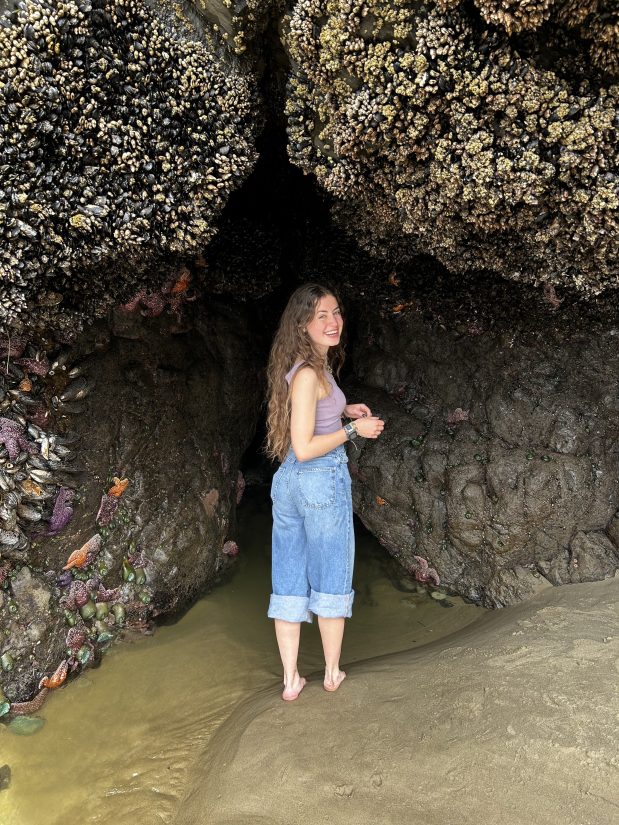 Student Intern Serena in a cave at the beach